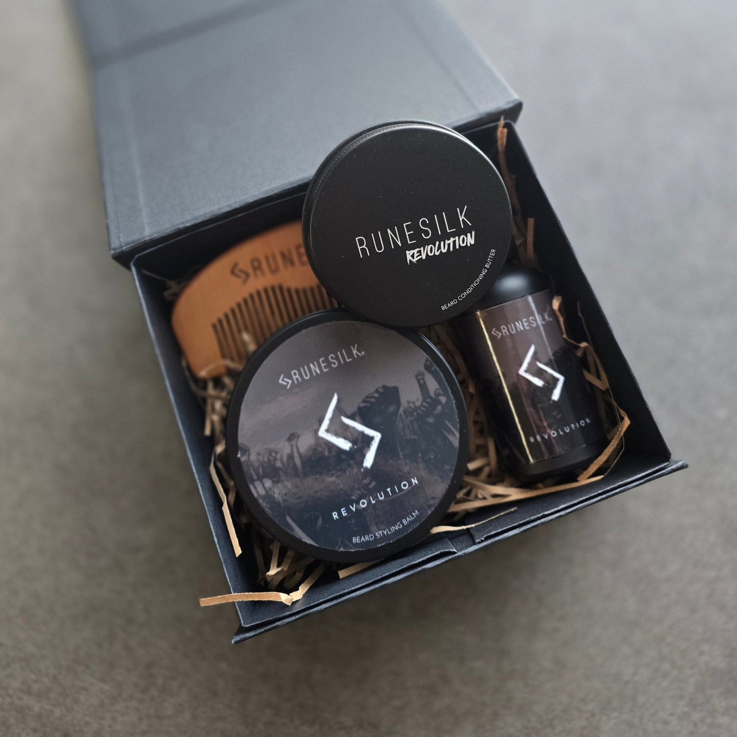 Runesilk beard care products in a box on a gray background