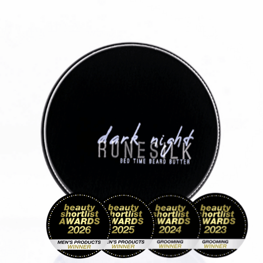 Black container of 'dark night RUNESILK' bed time beard butter with five gold and black awards below on a white background.